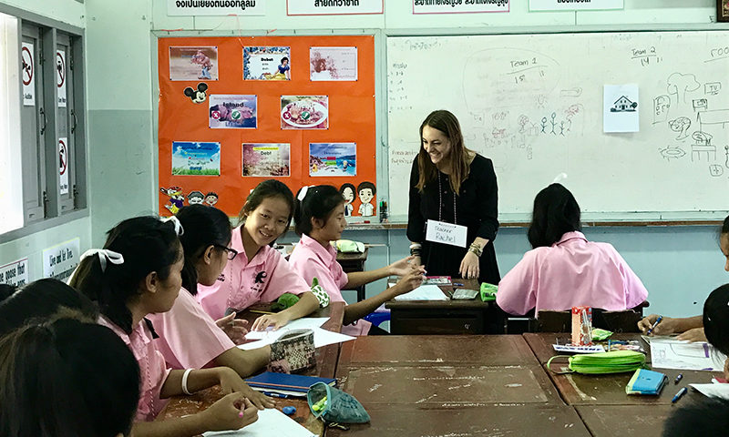 An English teacher in a classroom of Thai students.
