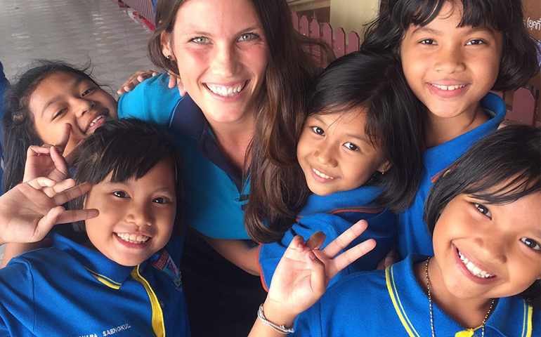 A teacher with kids in Thailand.