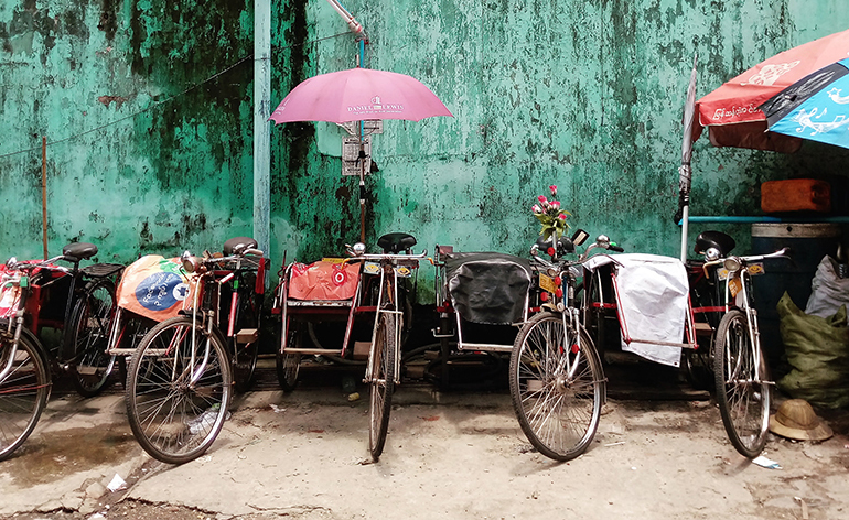 Trishaws lined up in Yangon, Myanmar.