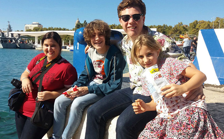 A Greenheart Traveler bonding with his host family.