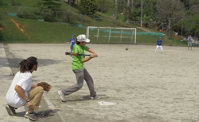 Greenheart Traveler, Mac Hightower, playing baseball with youth in Colombia.